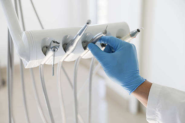 Professional Tooth Extraction technician working in DeKalb, IL